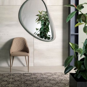 Sillón Betta de Ozzio design. Estructura metálica tapizada en piel, ecopiel o terciopelo.