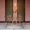 Mesa comedor con sobre de vidrio Sir Gio redonda de Kartell.