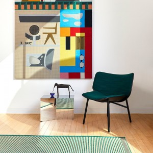 Butaca Dapper para salón de madera con patas de acero de HAY.